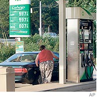 [Post-Katrina, gas prices rose at a Stockbridge, Ga., station.]
